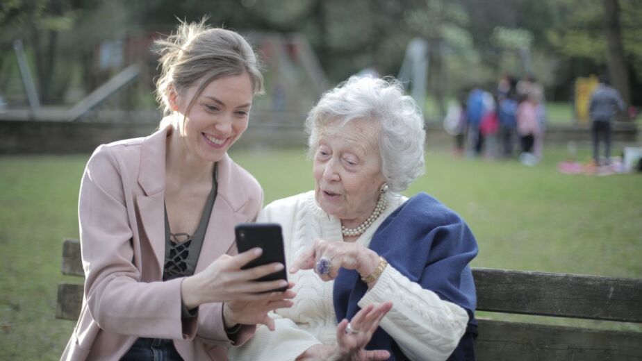 Senior smiling while getting phone support