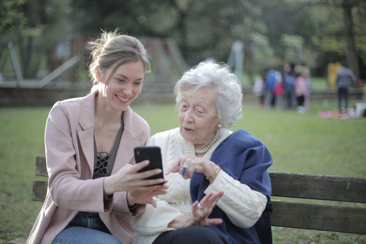Senior smiling while getting phone support